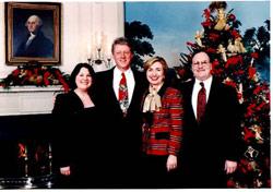 Nancy, President and Hillary Clinton, and Rev. Richard M. Stower at a White House holiday party.