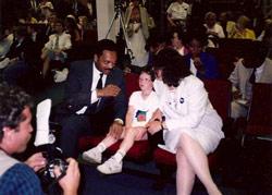 1988 Presidential candidate, Rev. Jesse Jackson, Nancy's son, Jonathan (age 8) and Nancy (sporting a Biden for President button and explaining why to Rev. Jackson)